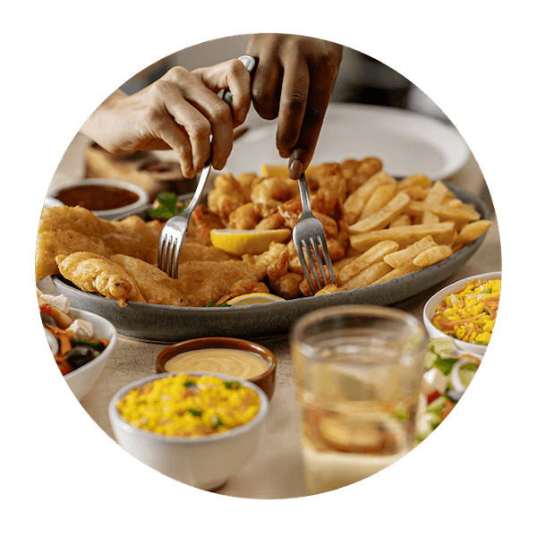 Fish and seafood sharing platter with rice and salad