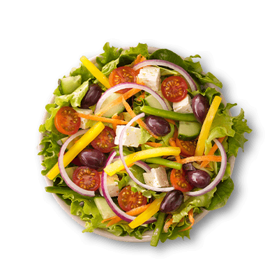 Fresh greek salad in a white bowl