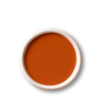 Spicy sauce in white bowl