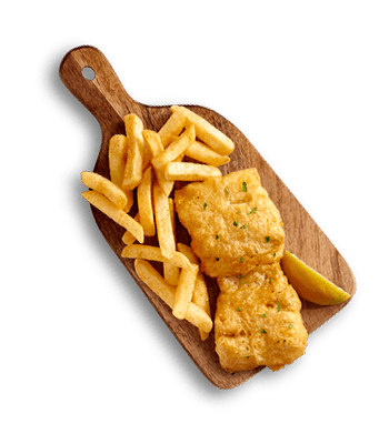 Golden battered fish fillets served with french fries and a lemon wedge on a rustic wooden board.