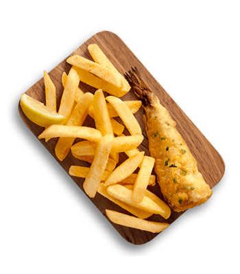 Crispy golden battered fish fillet served with thick-cut french fries and a lemon wedge on a wooden board.