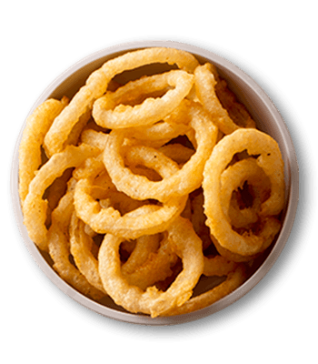Crispy onion rings in a white bowl