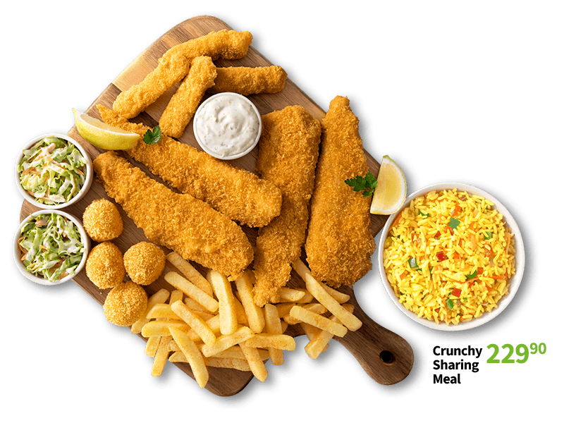 Crispy fried fish platter served with French fries, savory yellow rice, coleslaw, tartar sauce, and lemon wedges.