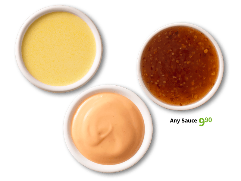 Three different sauces in white bowls