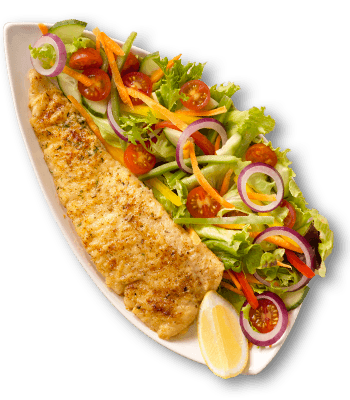 Grilled fish fillet served on a platter with a side salad of lettuce, tomatoes, red onions, and a lemon wedge.
