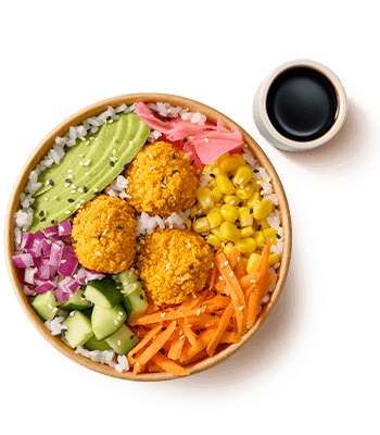 Poke bowl featuring white rice, golden crispy bites, avocado, pickled ginger, corn, red onion, cucumber, and shredded carrots. Accompanied by soy sauce.