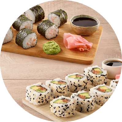 Assorted sushi rolls with soy sauce, wasabi and pickled ginger