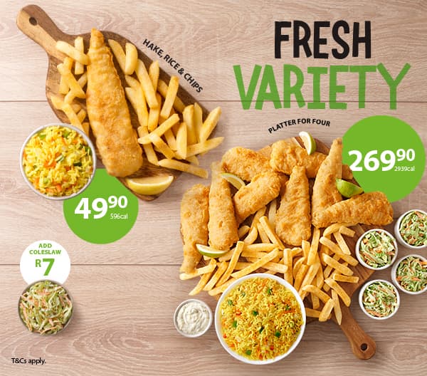 Takeaway lunch meals from Fishaways including two seafood lunch boxes filled with hake fillets, fish pops, hake strips, onion rings, chips and Coke No Sugar against a wooden background.