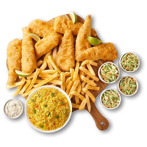 Hake fillets with chips and rice on a wooden board