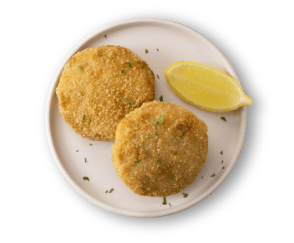Fishcakes on a plate with slice of lemon