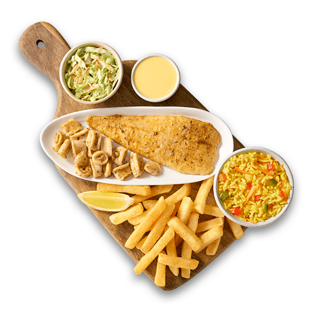 Hake fillets with chips, pop prawns and rice on a wooden board