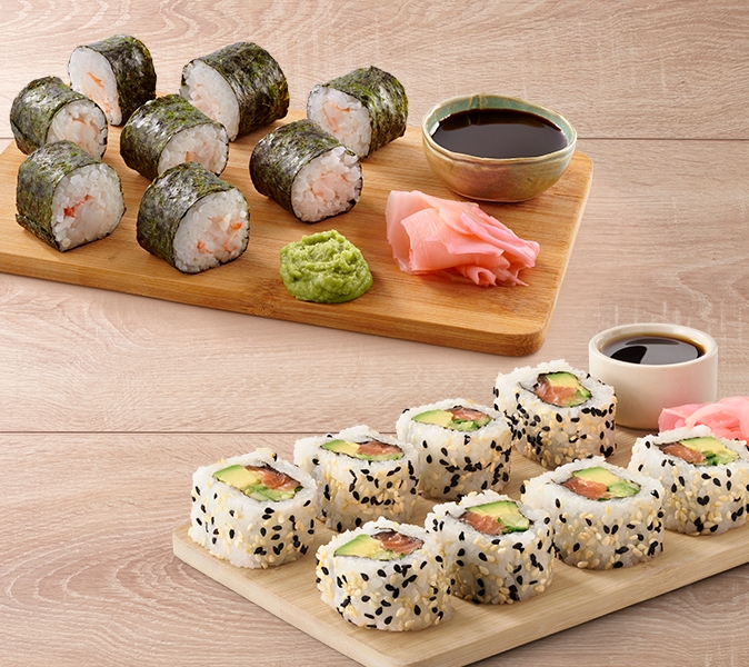 Maki rolls with nori on the outside and California rolls with rice on the outside